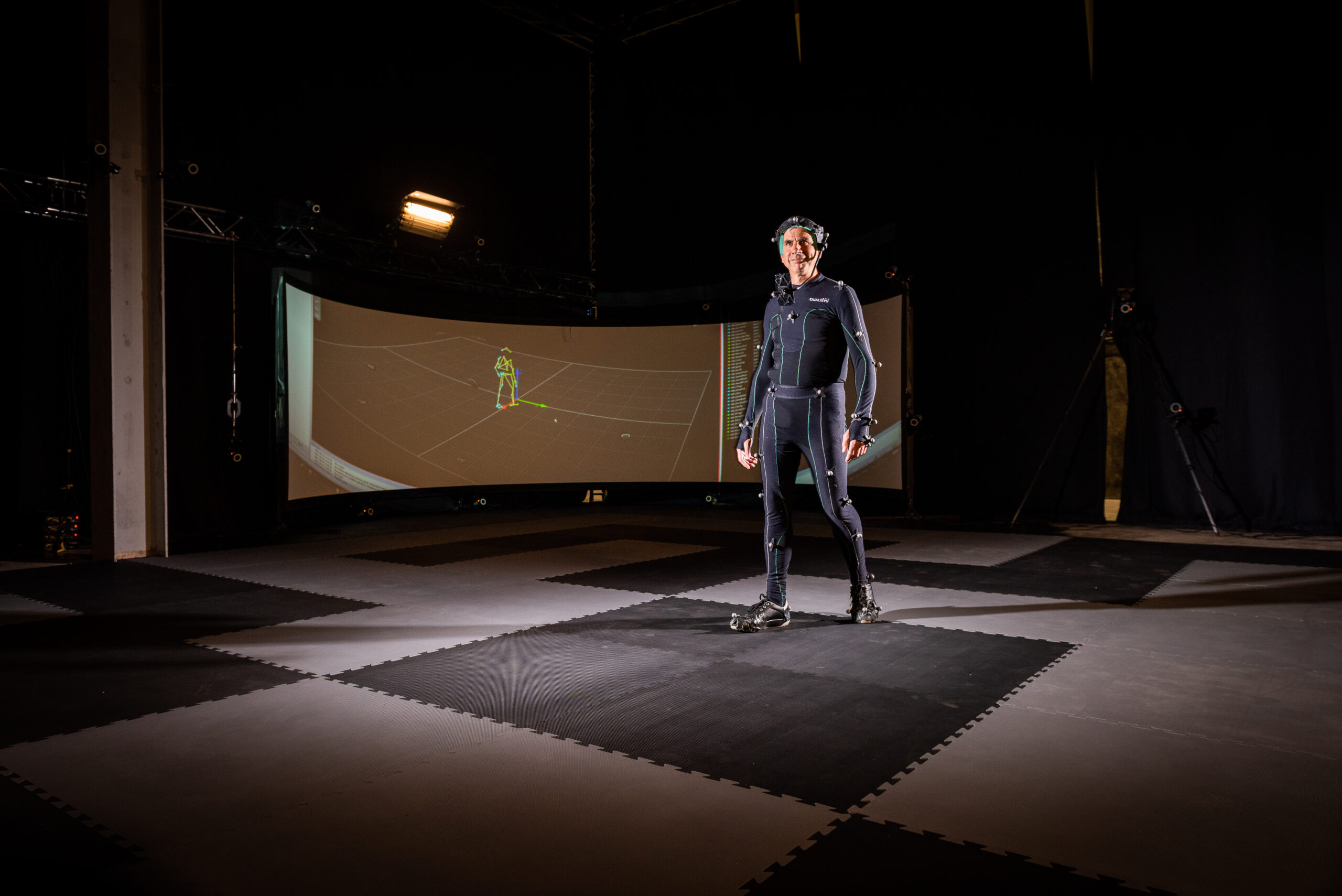 An image of a man stood in CAMERA's motion capture stage.