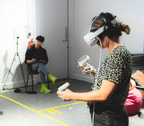 An image of a woman wearing a VR headset.